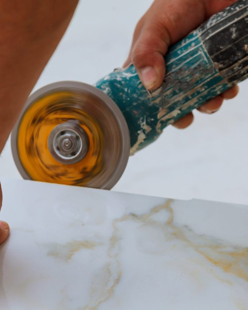industrial tiler builder worker installing floor tile at repair renovation work